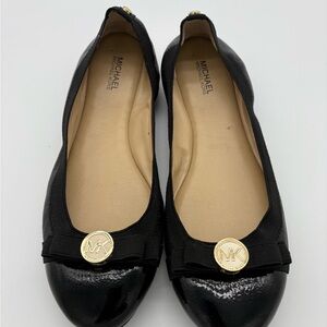 Michael Kors Black Patent Flats with Gold Logo